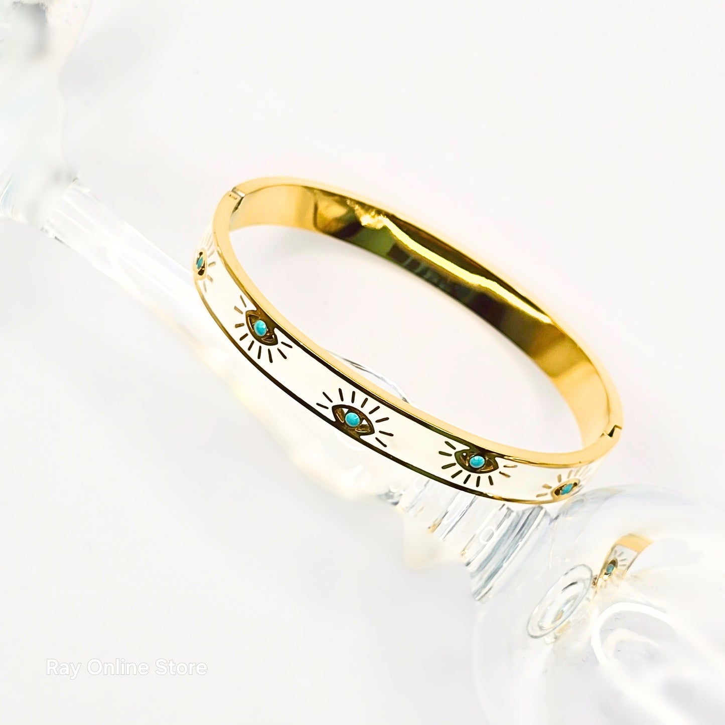 White enamel gold-plated evil eye bangle for everyday wear, tarnish-free and elegant