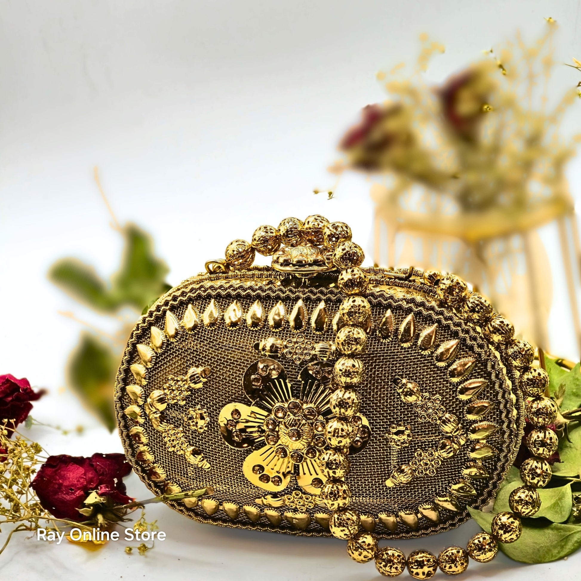 Get ready to add a touch of glamour to your outfit with this golden vintage beauty all the way from Patiala, India! Featuring intricate ethnic gold carvings, bright yellow stones on the clasp, and a stunning floral motif, this hand-crafted mini bag is the perfect accessory for any occasion. Don't miss out on the finesse of Indian artisans with this elegant piece.