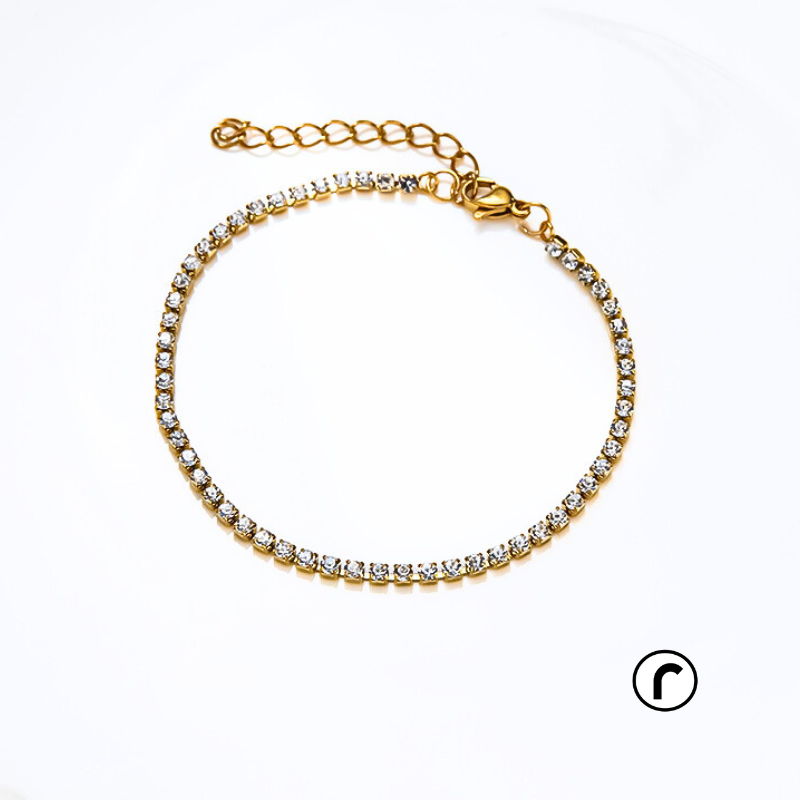 
The Arctic Zircon Bracelet is made with 316L stainless steel and finished with a gold plating for a luxurious touch. Tarnish-free and waterproof, this Zircon tennis bracelet can be worn all day, making it the perfect accessory for any occasion. Expertly crafted for durability and style, it adds a touch of elegance to your outfit.