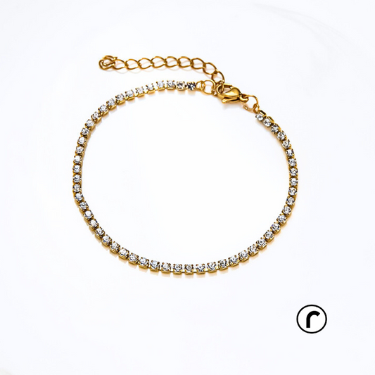 
The Arctic Zircon Bracelet is made with 316L stainless steel and finished with a gold plating for a luxurious touch. Tarnish-free and waterproof, this Zircon tennis bracelet can be worn all day, making it the perfect accessory for any occasion. Expertly crafted for durability and style, it adds a touch of elegance to your outfit.