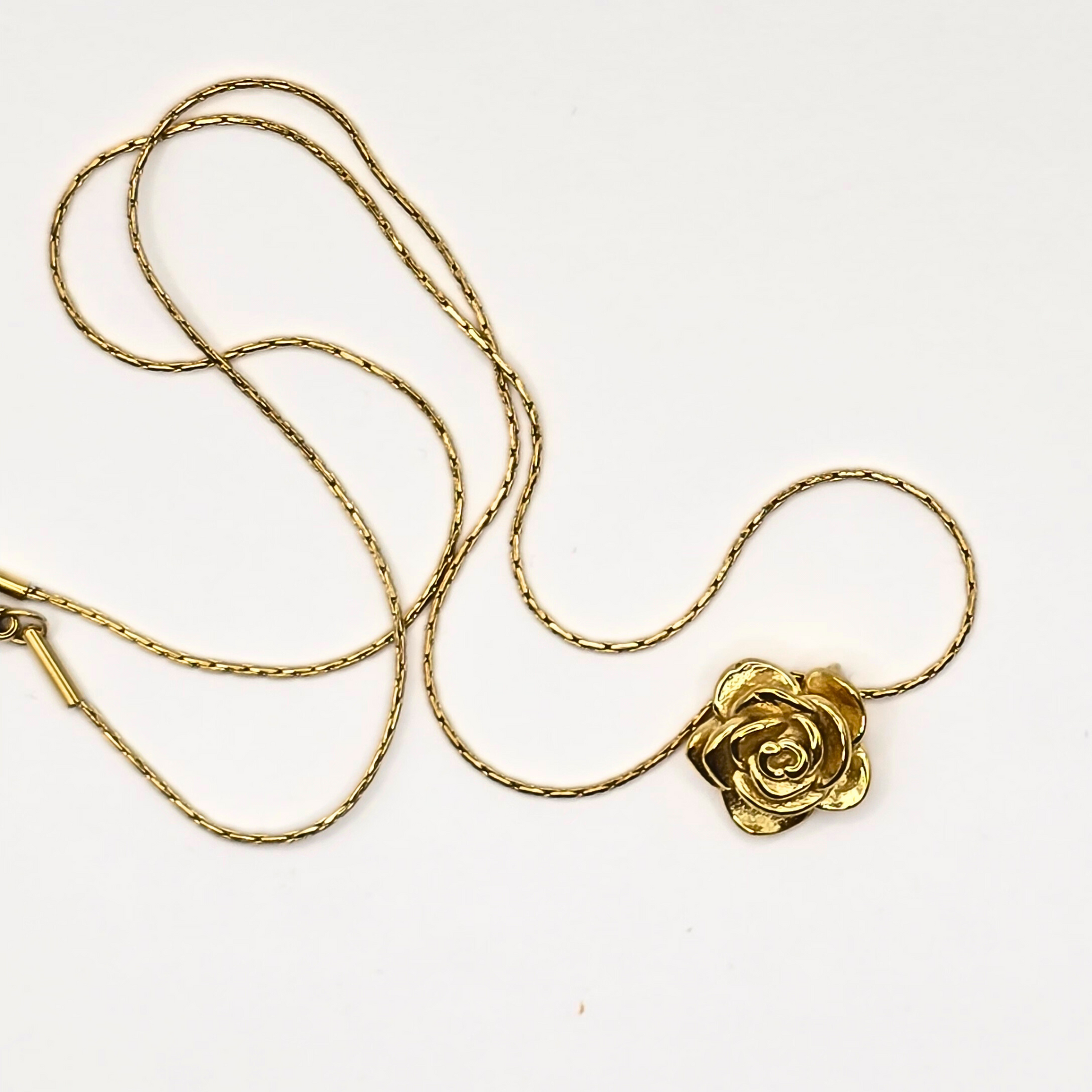 Gold-plated stainless steel necklace featuring a delicate rose pendant