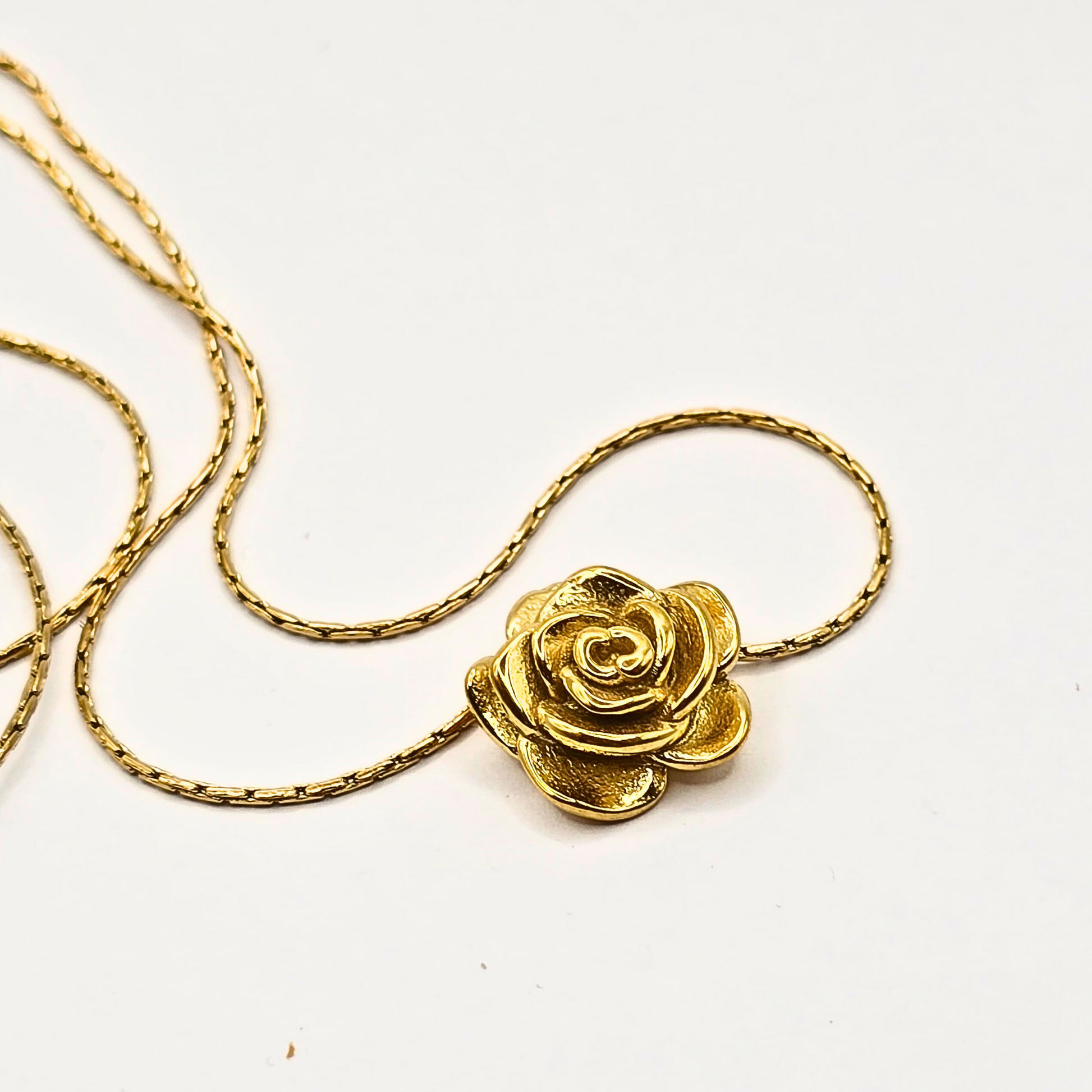 Gold-plated stainless steel necklace featuring a delicate rose pendant