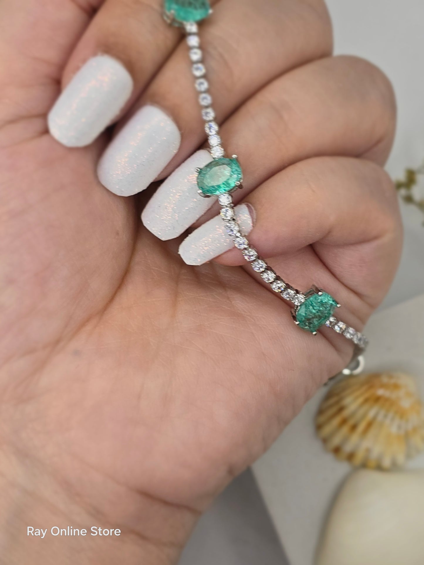 Indulge in elegance with our Mint Crystal Bracelet, featuring cool green colored stones and a sophisticated strand of crystals for a chic and eye-catching look. The high quality luster of this bracelet will add a touch of luxury to any outfit.