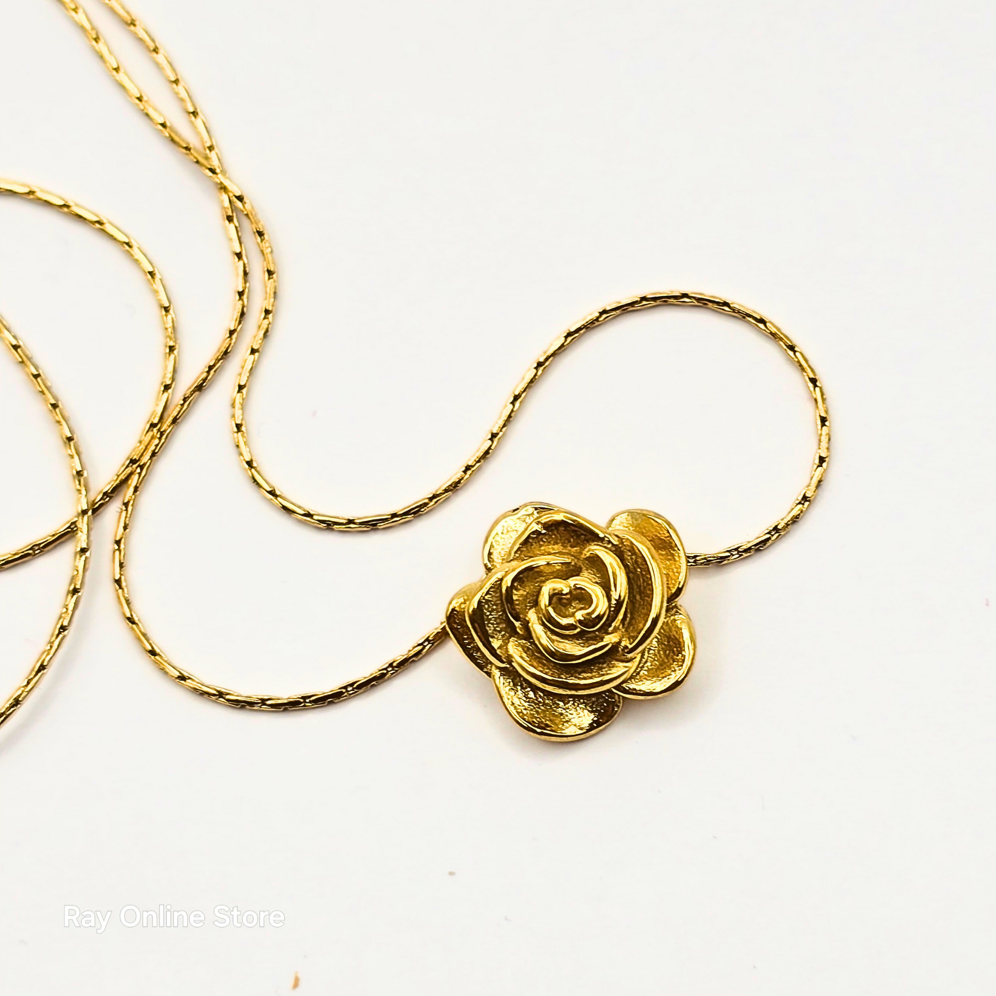 Gold-plated stainless steel necklace featuring a delicate rose pendant