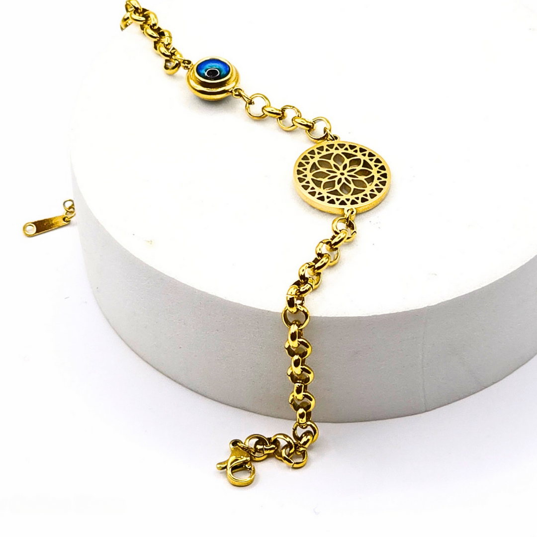 Gold-plated filigree bracelet with an evil eye charm, crafted from stainless steel with an adjustable link chain.
